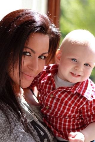 a woman holding a baby